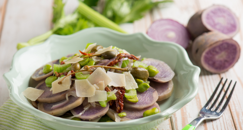 vegetables salad with purple potatoes broad beans sliced parmesan cheese